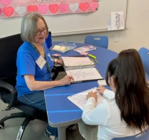 Esther teaching kids at Palomino School